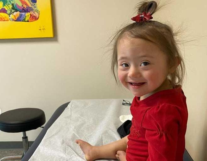 Ariel sitting on exam table at doctor office